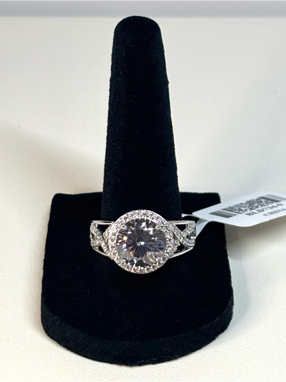 Sterling silver ring with a 6 carat white round stone and halo